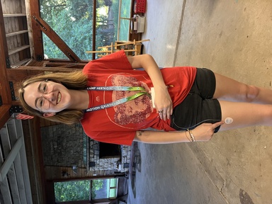 Third-year human physiology major Ava Russ tries on an insulin pump for training purposes. Russ volunteers at a summer camp for kids with type 1 diabetes.