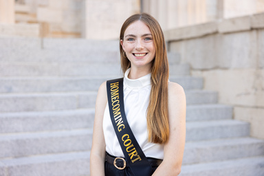 1.	Abigail Adams, who recently served on the University of Iowa’s homecoming court, poses outside the Old Capital, contributed by Adams.