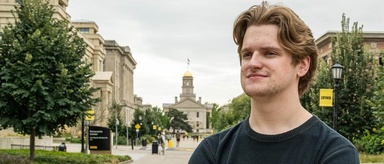 Tyler Draayer poses on the Blank Honors Center balcony. Photo by Justin Torner.